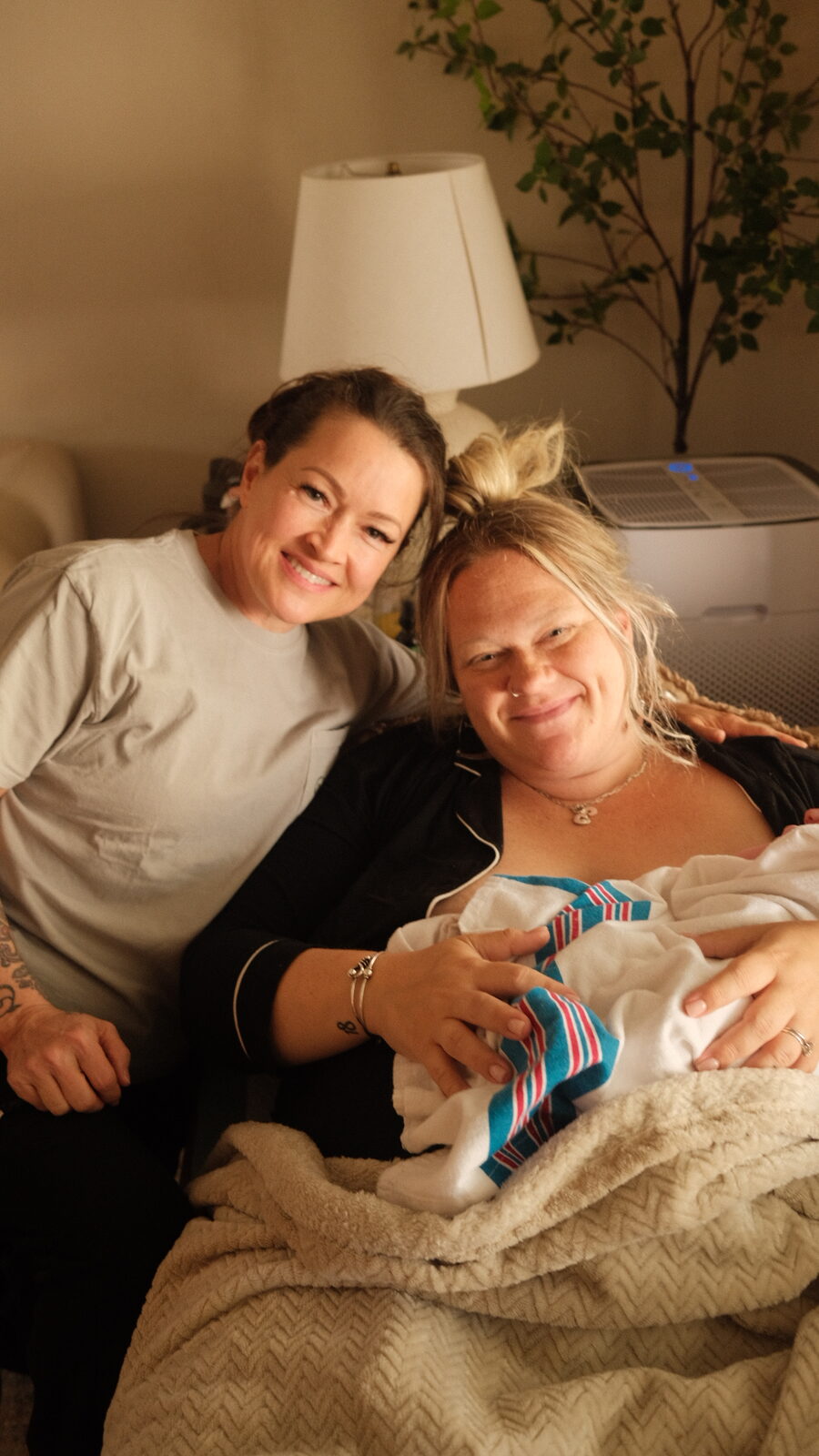 A mother and family with their new baby